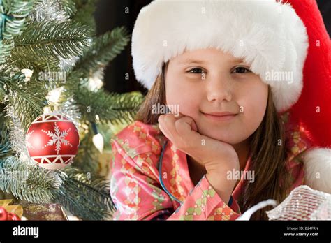 Girl By Christmas Tree Stock Photo Alamy