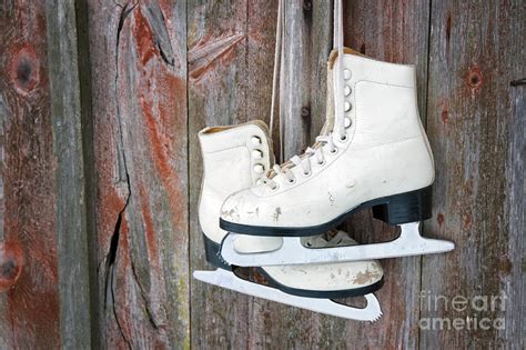 Old Skates Hanging On A Wooden Wall Photograph By Anna Mari West