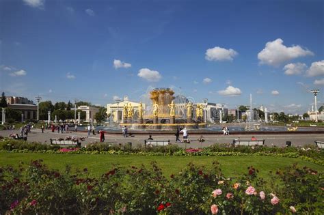 Tourists Walk Near The Fountain Fountain Friendship Of Peoples On The