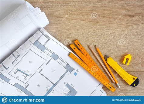 Architectural Drawings And Pencils Ruler Clerical Knife On Wooden