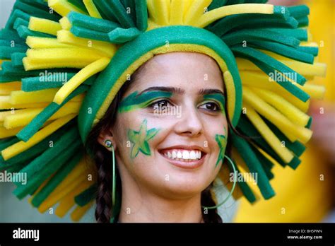 A Pretty Female Brazilian Football Fan With A Painted Face In The