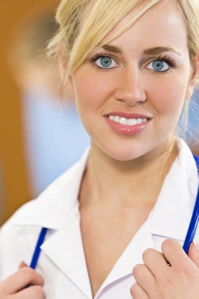 Beautiful Blond Female Nurse With Blue Eyes — Stock Photo © Dmbaker