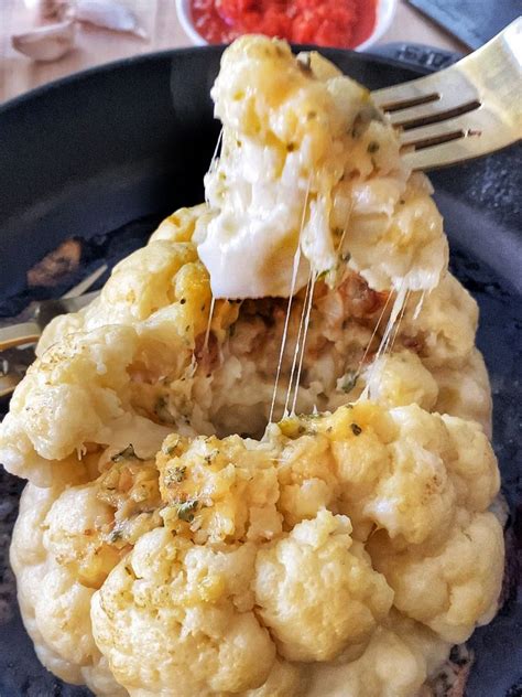 Roasted Whole Cauliflower With Garlic And Cheese Recipe The Delicious