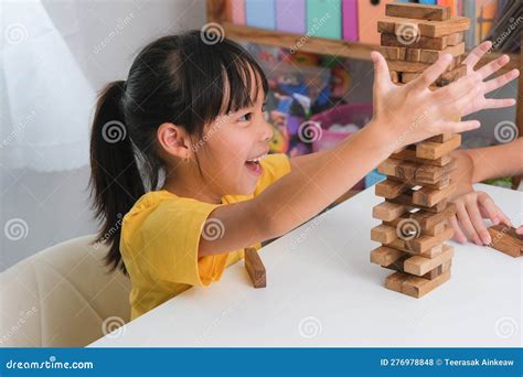 Cute Asian Siblings Having Fun Playing Jenga Together Two Children