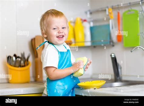 Toddler Boy Child Washing Up Kitchen Hi Res Stock Photography And