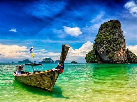 Pranang Beach And Rock Krabi Thailand Long Tail Boat On A