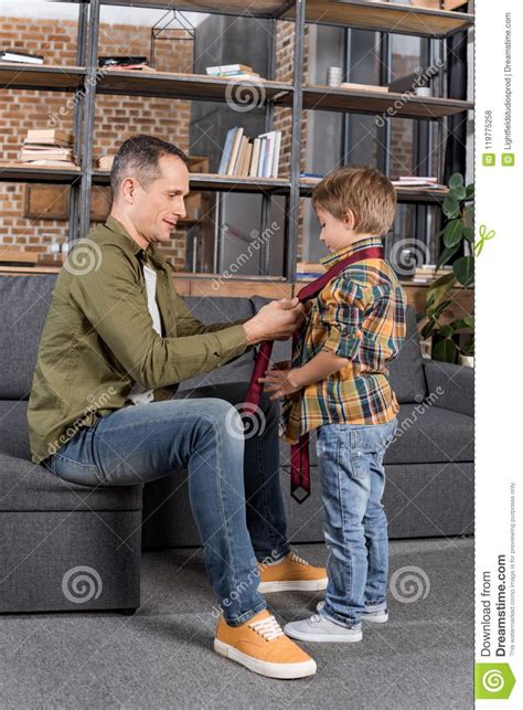 Side View Of Father Teaching Son To Tie Necktie Stock Photo Image Of