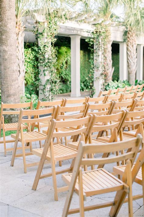 Wooden Chairs At An Outdoor Ceremony At Cannon Green In Charleston Sc
