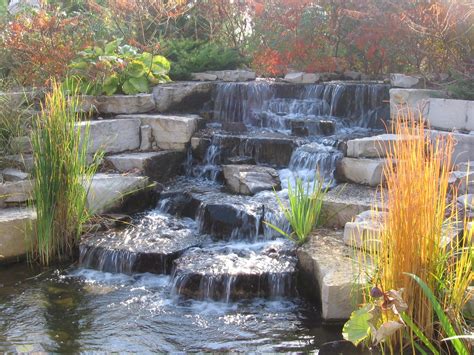 landscaped ponds waterfalls add a soothing oasis to your backyard