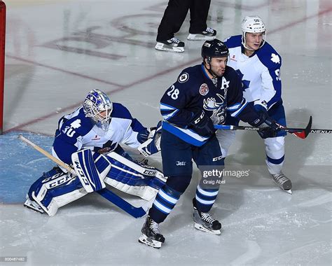 Goalie Rob Madore And Viktor Loov Of The Toronto Marlies Look For The