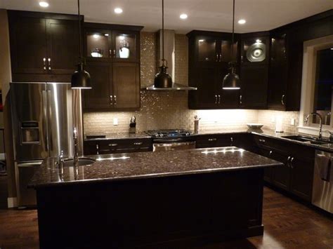 Dark cabinets and flooring truly complement the complexity of the a contemporary kitchen style with dark elements creates a minimalistic design. Tile Backsplash Ideas For Kitchens- Kitchen Tile ...