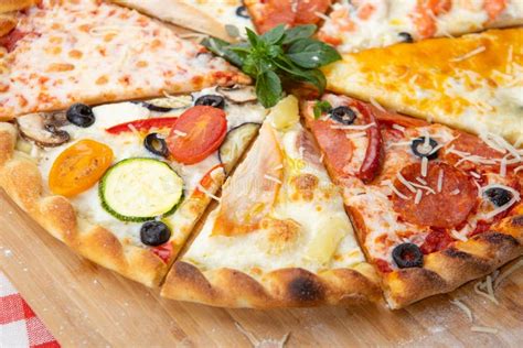 Assorted Pieces Of Pizza Closeup With Different Ingredients Decorated