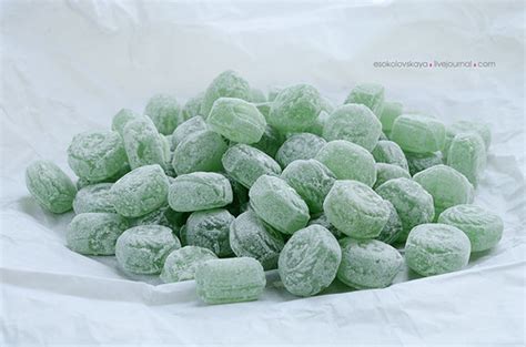 Mint Sugar Candies Heap Of Mint Lollipops On White Paper B