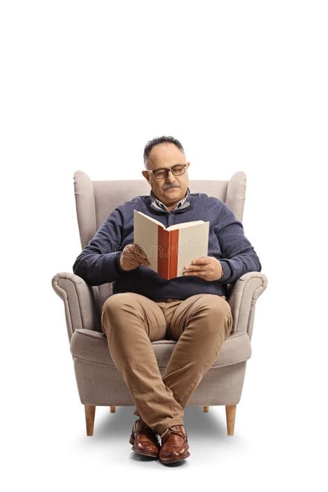 Man Reading Book Seated Armchair Stock Photos Free And Royalty Free