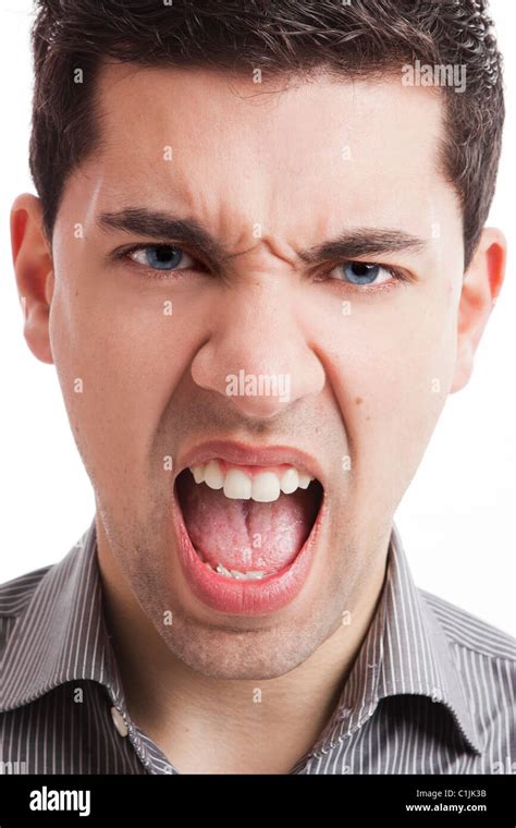 Portrait Of A Angry Young Man Yelling Isolated On White Background