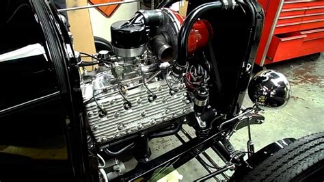 Note the unusual distributor, driven off the camshaft, and the simple exhaust manifold. supercharged flathead McCulloch - YouTube