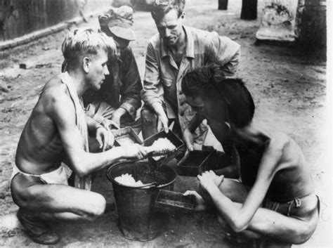 Liberated Pows At A Rangoon Jail Share A Last Meal Of Rice Before Being
