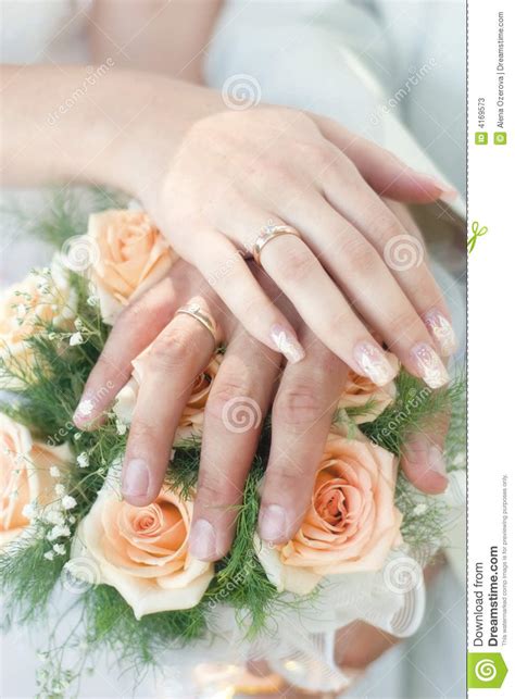 Only a few choose to not wear the engagement ring at all anymore. Hands with wedding rings stock image. Image of blossom ...