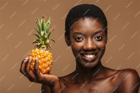 Premium Photo Beauty Portrait Of Pretty Young Half Naked African Woman Holding Pineapple