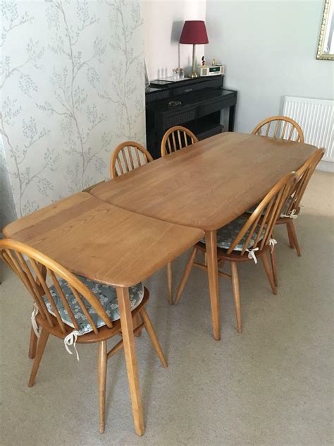 Ercol Plank Dining Table With Three Legged Extension And 6 Chairs In