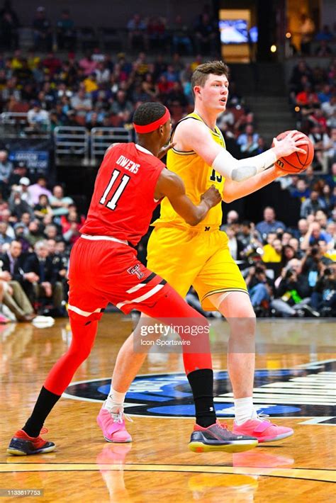 michigan center jon teske looks to make a pass during the ncaa news photo getty images