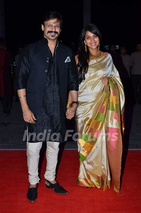 Vivek Oberoi Poses With Wife Priyanka Alva Oberoi At Kush Sinhas