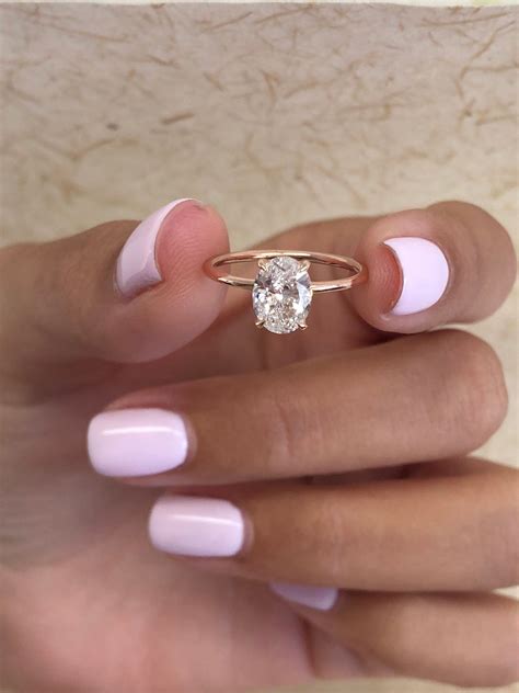 Adiamor's thin band engagement ring collection features a modern take on classic styles with band widths ranging from 1.5mm to 1.7mm. Oval Diamond Engagement Ring 0.91 Carats Oval Diamond Ring ...