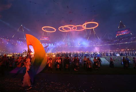 Young Athletes Light Olympic Cauldron During Opening Ceremony To Kick