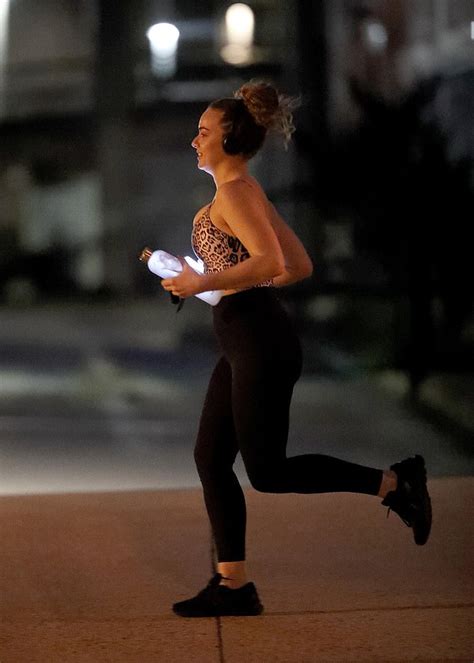 Abbie Chatfield Shows Off Cleavage In A Leopard Print Top During Run