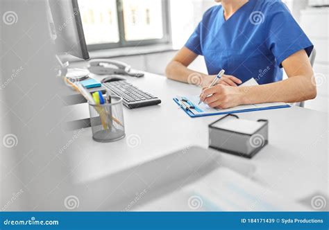 Doctor Or Nurse With Clipboard At Hospital Stock Image Image Of
