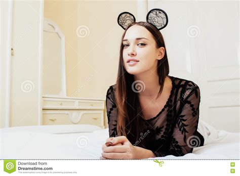 Young Pretty Brunette Woman Wearing Lace Mouse Ears Laying Waiting