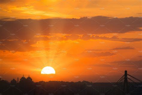 View Of Dramatic Sunset With Orange Sky Bright Sun And Dark Silhouette