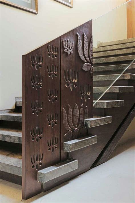 The Stairs Are Made Of Metal And Have Intricate Designs On Them
