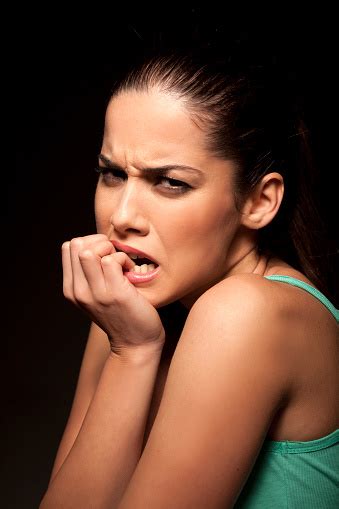 Portrait Of Angry Nervous Girl Biting Her Nails Stock Photo Download