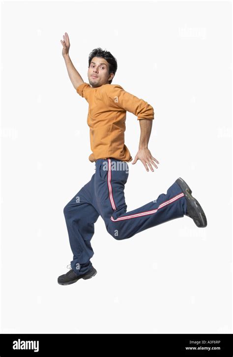 Side Profile Of A Young Man Jumping Stock Photo Alamy