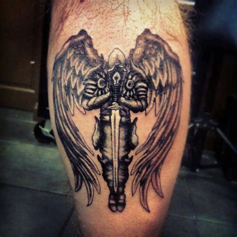 Many angel tattoos are depicted with wings, sometimes it's only the wings that are used. arch angel warrior sword tattoo on leg black and white ...