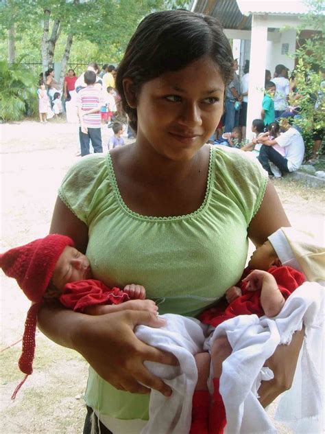 A Woman With Her Twin Babies From Honduras We Are The World People