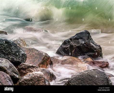 Rocky Seashore With Stormy Sea Waves Stock Photo Alamy