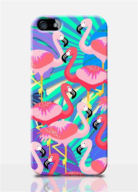 A Phone Case With Pink Flamingos And Palm Leaves On It Against A Blue