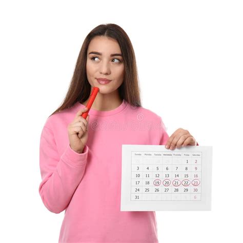 Young Woman Holding Calendar With Marked Menstrual Cycle Days Isolated