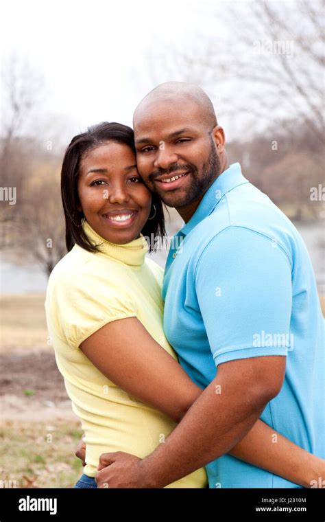 Loving Happy African American Couple Hugging And Smiling Stock Photo