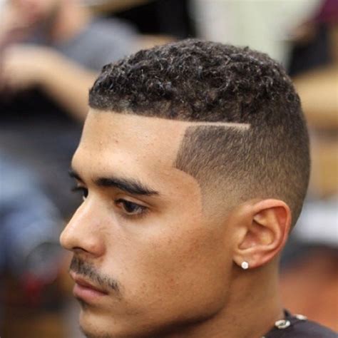 Drop fade along with the tattoo, if you have any. Clean fade with shaved part - curly hair | Men's Grooming ...