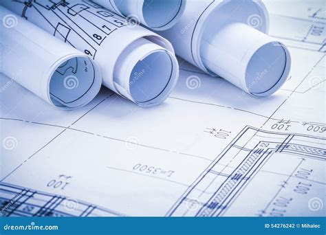 Rolled Blueprints And Architectural Drawings On Desk Royalty Free Stock