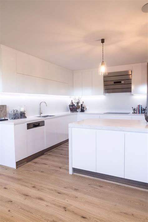 We like the fresh white stone with subtle but significant grey veins giving our waterfall kitchen island at our home in malibu. 5131 Calacatta Nuvo™ by Caesarstone | Caesarstone, Calacatta, Kitchen bench tops