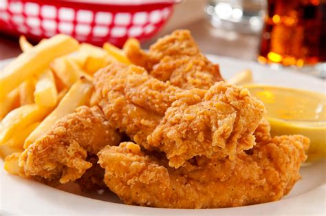 Download Delicious Tender Chicken And Fries Wallpaper