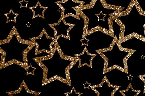 Golden Glitter Stars Floating On Black Background Free