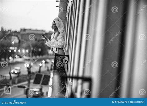 Woman In A White Robe Standing On The Balcony Stock Photo Image Of