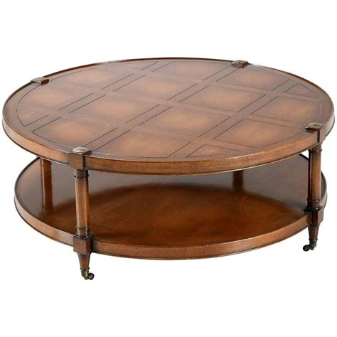 Caster wheels complete the look while offering easy movement. Heritage Mahogany Round Coffee Table on casters at 1stDibs