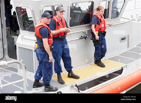 The Crew Of The Us Coast Guard Response Boat Medium Rb M 45610 Helps