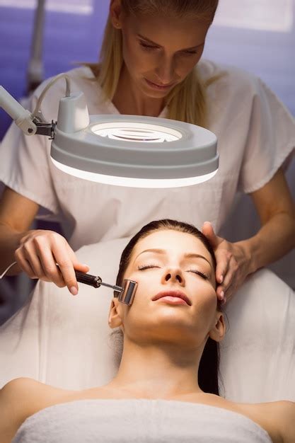 Free Photo Dermatologist Performing Laser Hair Removal On Patient